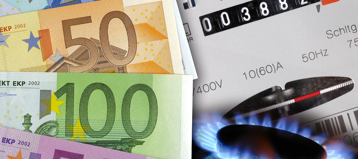Preisfallen der Gasanbieter Bargeldscheine und Gaszähler